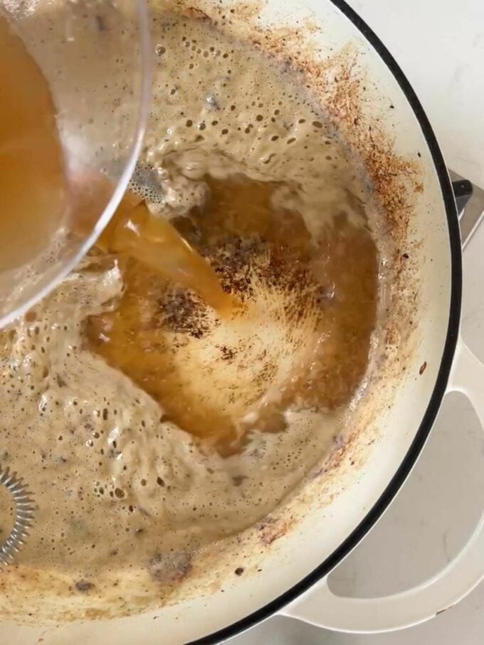 How to make Swedish Meatballs Step 4. Add the stock to the sauce.